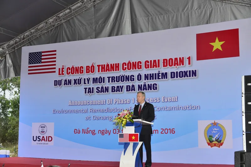 A speaker addresses a crowd at a stage event marking dioxin remediation success at Da Nang Airport. A speaker addresses a crowd at a stage event marking dioxin remediation success at Da Nang Airport.