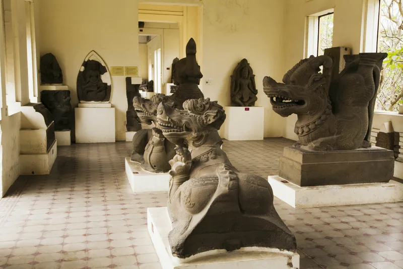 Stone Cham lion and dragon sculptures displayed on pedestals in a museum gallery in Da Nang. Stone Cham lion and dragon sculptures displayed on pedestals in a museum gallery in Da Nang.